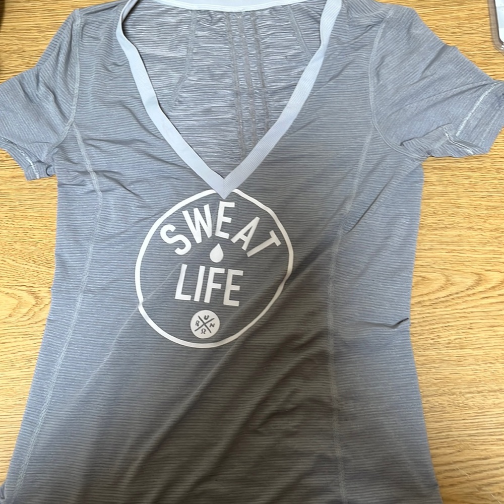 Lululemon shirt, approximately M, no tag but measurements shown.